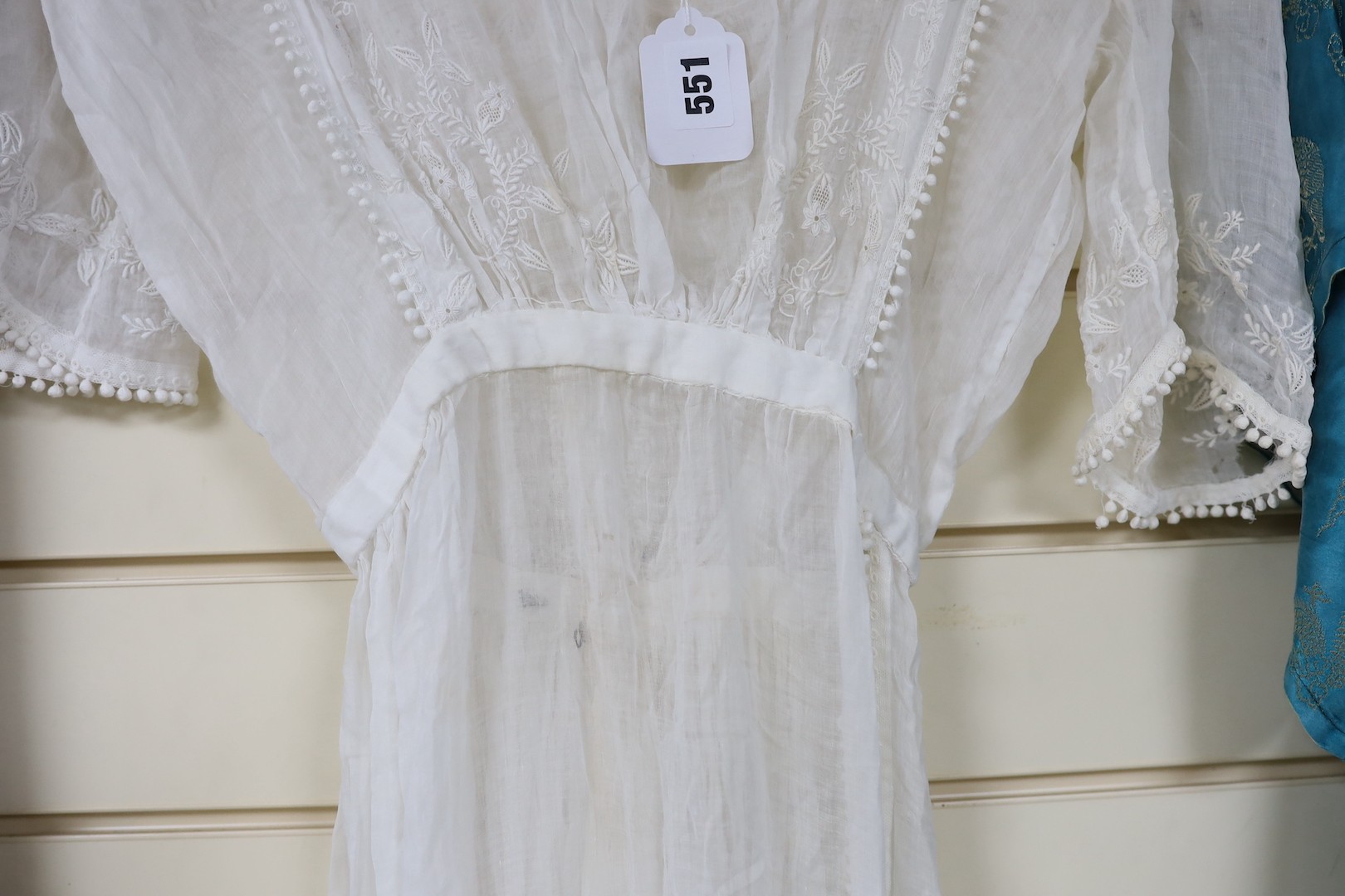 A late 19th early / 20th century fine muslin ladies summer dress, with a white worked bodice trimmed with fine bobbling edge and side slit